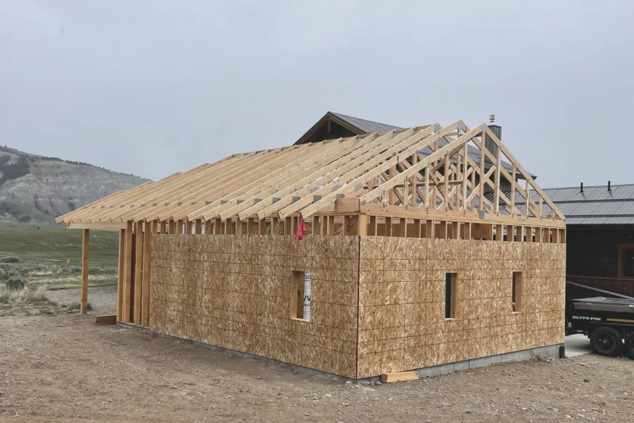 Roof sheathing going on from the eave up